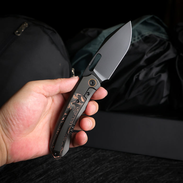Remette ORCATB RT-Orca (M390, Drop Point, Pearlescent, Titanium & Carbon Fiber, Button Frame Lock) Pocket Knife