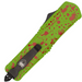 A tactical pocket knife with a bright lime green handle featuring red blood splatter details, a black clip, and a black textured blade, shown on a plain white background.