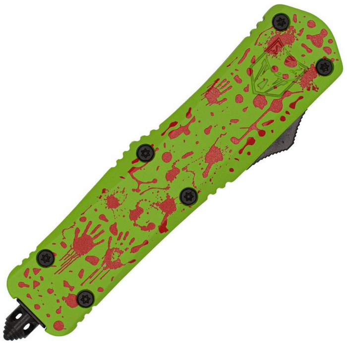 A tactical folding knife with a bright lime green handle decorated with red blood splatters and handprints, shown against a plain white background.